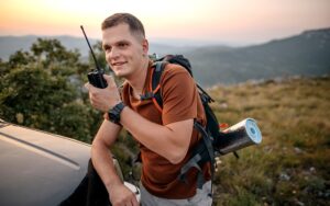 A climber using a walkie-talkie